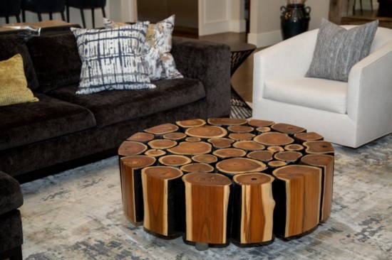 A round natural wood coffeetable from Nuvo Home pays homage to the trees and woods outside.