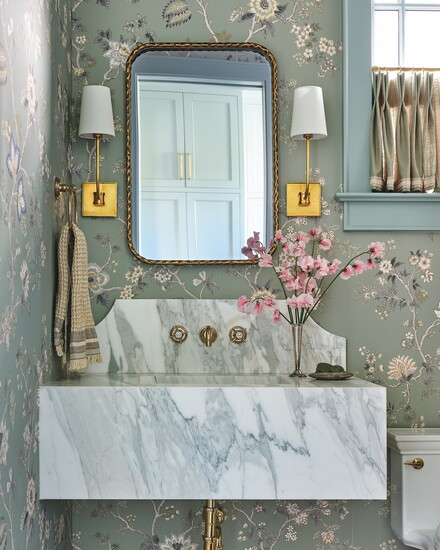 Harkey fabricated the custom floating vanity with decorative splash and integrated sink. Floral wallpaper by Lewis & Wood.