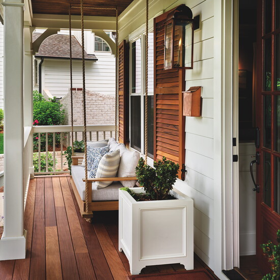 The original plan to paint the shutters was scrapped in favor of naked wood, without paint or stain, which reminded the homeowners of their love for the 