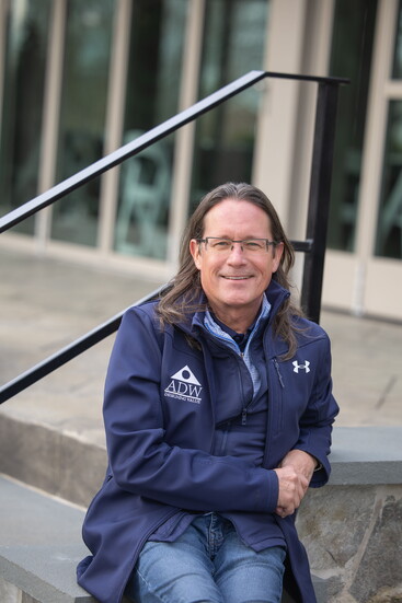 Paul Thompson in front of a property. Photo Credit: Kerry Dietz