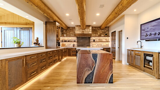 Stone, timber, and a slab island makes for an ideal Durango kitchen built for a crowd.