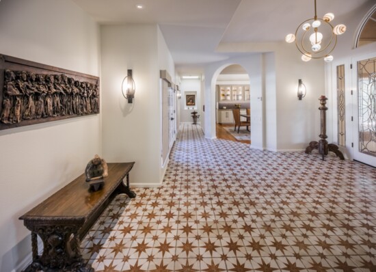 An elegant entry.  Floor tile from Tile Bar, Chandelier from Blackwell Lighting.  Art pieces from the client's own collection.