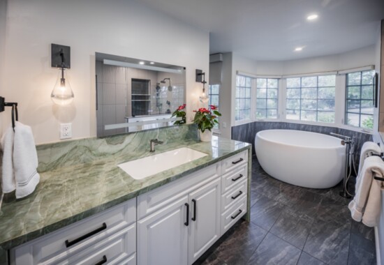 A grand master bath design.  Green quartzite from Brazilian Exotic.  Freestanding Solid Stone Tub:  Aquatica.  Lighting:  Restoration Hardware.