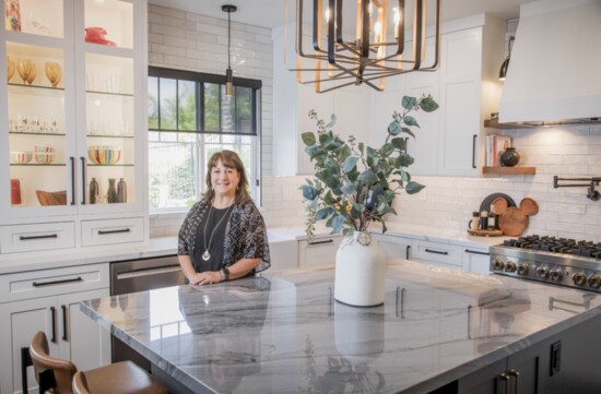 The designer in her kitchen at home.  Tile and stone from Arizona Tile, custom cabinets by Elite Cabinets and appliances by JennAir.