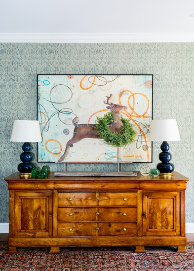 An elegant deer and lifelike wreath, both from Le Fleur