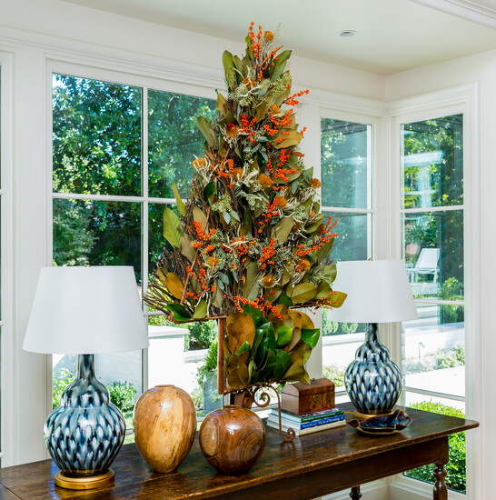 Replace the bittersweet with vibrant red Ilex berries for an easy shift from fall to holiday.