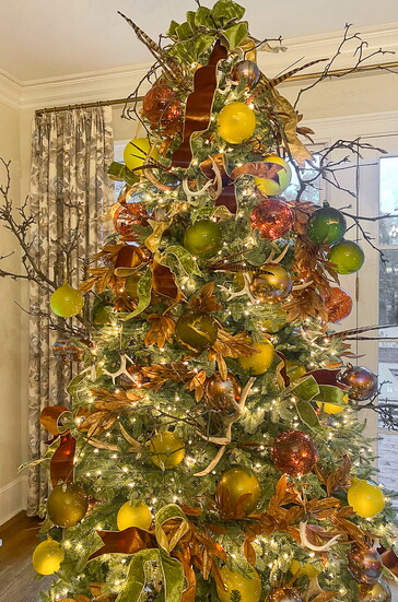 Tuck in a few branches to make your tree feel more natural and full