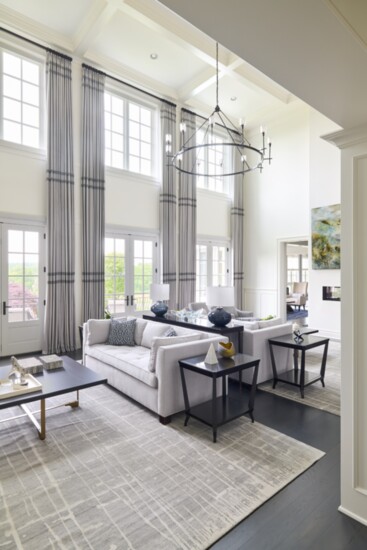 Example of two-zoned room. Interior design by Donna Hoffman/Impeccably Designed Homes. Photo by Bartholomew Studios.