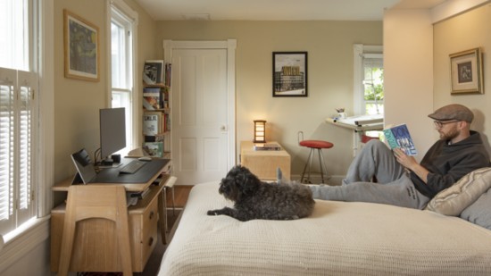 Adding a wall-bed and desk to this guest room helps it do double duty