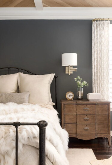 A master bedroom with a soft hint of moodiness.