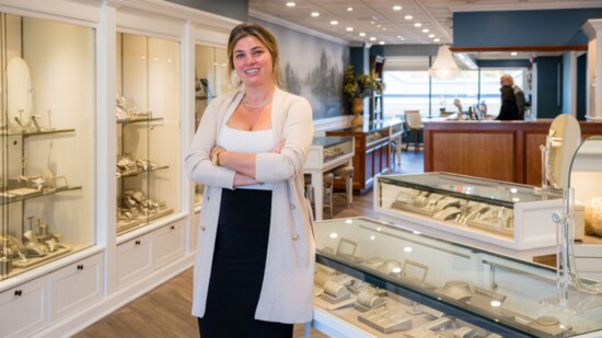 Tara stands at the front of Main Street's new jewelry Store Desires by Mikolay