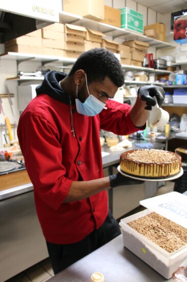 Finishing touches on a signature Cheesecake at Hank's Cheesecakes