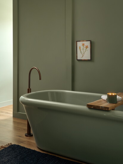 Two distinct green color palettes, rich sage and deep emerald, create a nuanced visual experience that reflects the property's design philosophy.