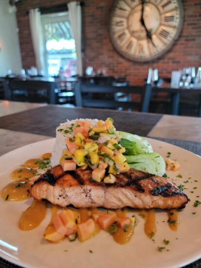 Grilled Salmon topped with a papaya mango cucumber pico at Little Goose