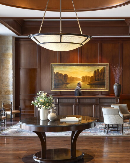 Renovated guest rooms feature hand stitched leather details and neutral tones while handcrafted woods honor the building’s historic saddle factory roots.