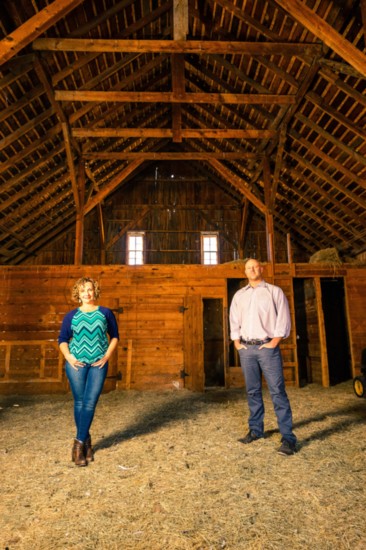 Elizabeth and Kory Craft, standing in the 1912 barn at Fox Hill, are consultants for the development and are helping establish the orchards and other crops.