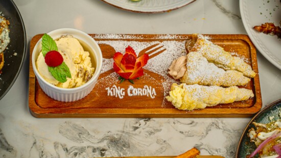 Save room for Cuernitos Rellenos, puff pastry cones stuffed with dulce de leche and cream custard, served with butter pecan ice cream