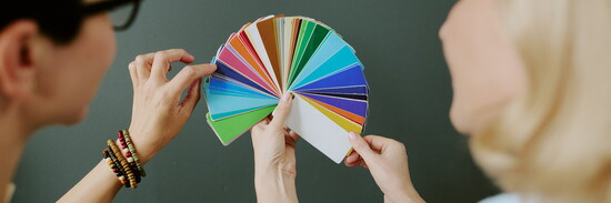 A vibrant fan of fabric swatches showcases the full spectrum of color.