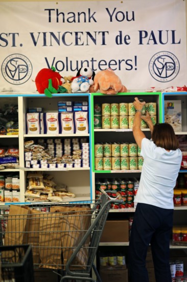 Volunteer Conni Slape shops based on a client's list.