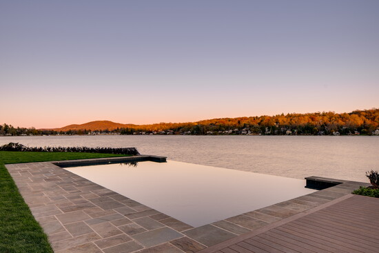 An island trail pool created by B&B Pool and Spa