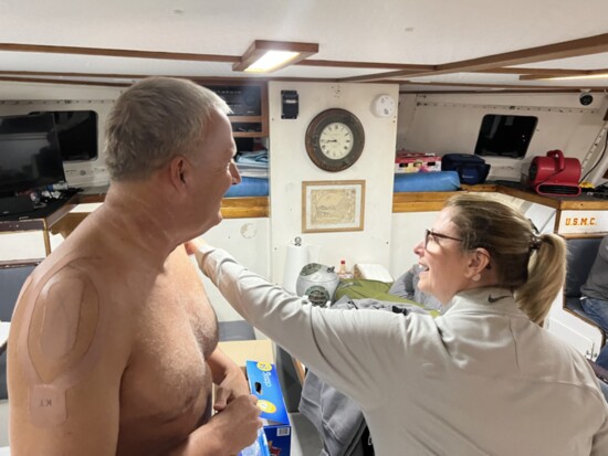Photo provided | Mary, John’s wife, applying ointment before the swim.