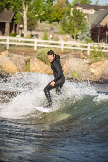 Surfer Chase Seamons at the BPRD whitewater wave park on the Deschutes River. Photo credit: Jesse Polay