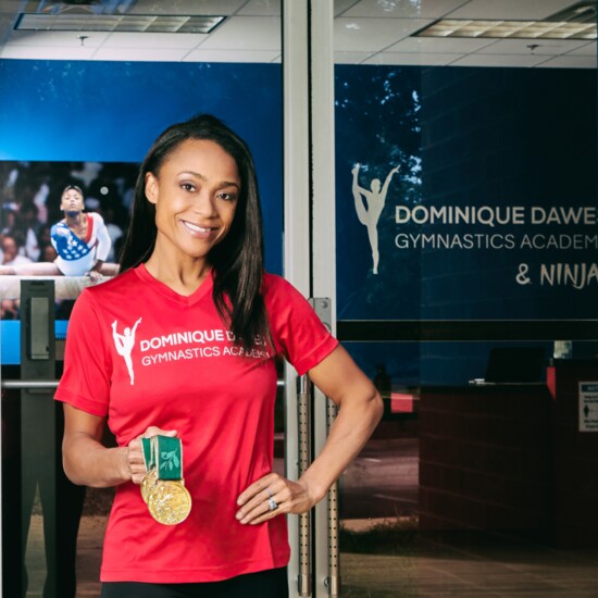  Dominique Displays one of her Olympic Gold Medal