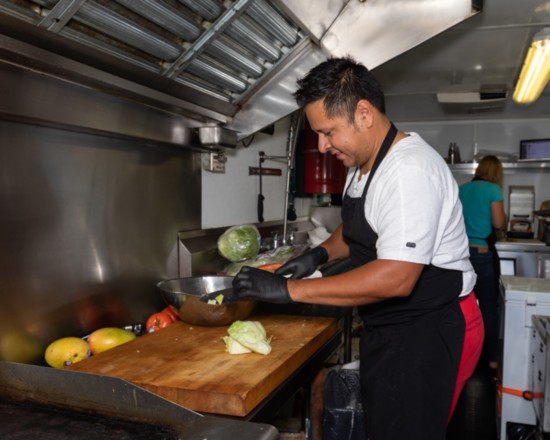 Miguel Martinez prepares fresh vegetables daily in his food truck.