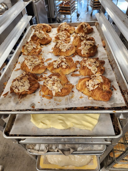 Almond croissants, fresh and ready to eat at Les Pascals.