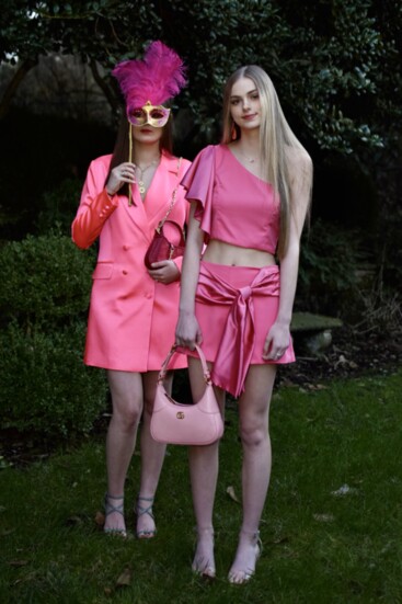 Flamingo in two piece outfit from Hemline with pastel pink Gucci bag.