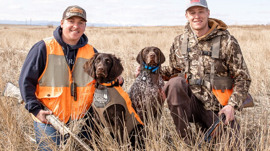 Austin Griffith and Kaleb Barton with their hunting dogs