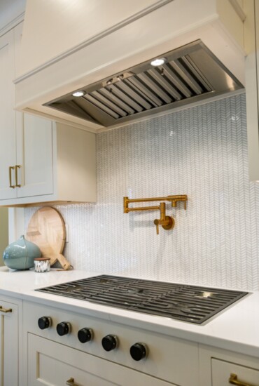 Light grout keeps this gorgeous marble backsplash looking crisp with equal parts texture and sparkle.