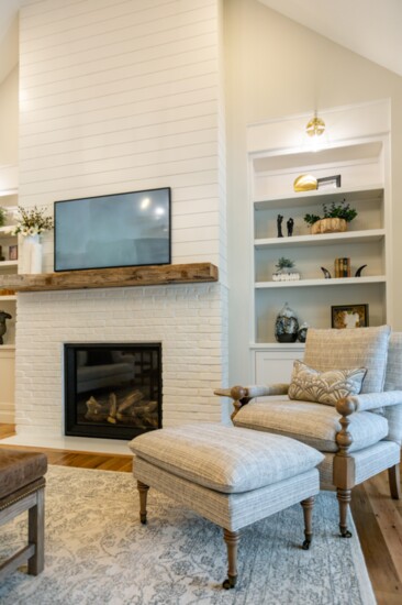You get the best of both "looks" with this fireplace—a painted brick base that continues up with shiplap.