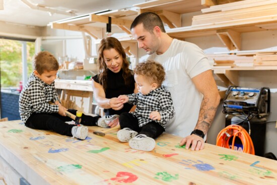 Keenan and his family in his shop.