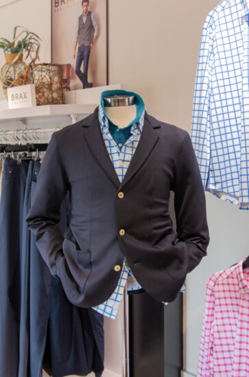 Green and blue polo by Ferrante. White and blue check shirt and unstructured jacket by Buki. 