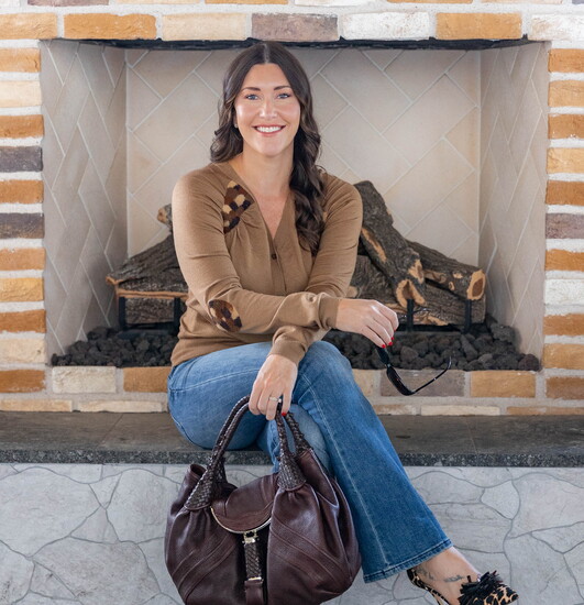 Button-down sweater by Prada; jeans by Pilcro; leopard heels by J. Crew Collection; handbag by Fendi