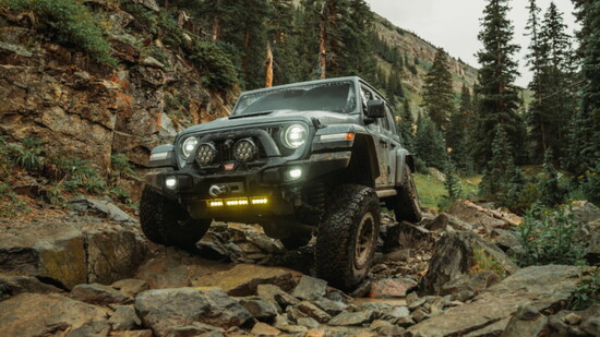 The AEV JL37O Wrangler easily cruising over tricky terrain
