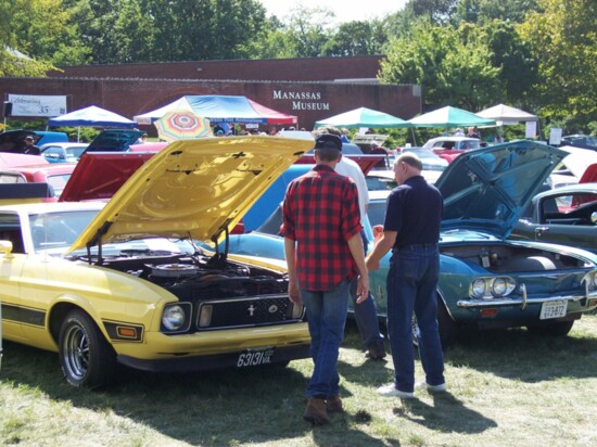 Attendees at the Edgar Rohr Memorial Car Meet in Manassas check out a Mustang and Corvair. Photo courtesy the Bull Run Region, AACA.