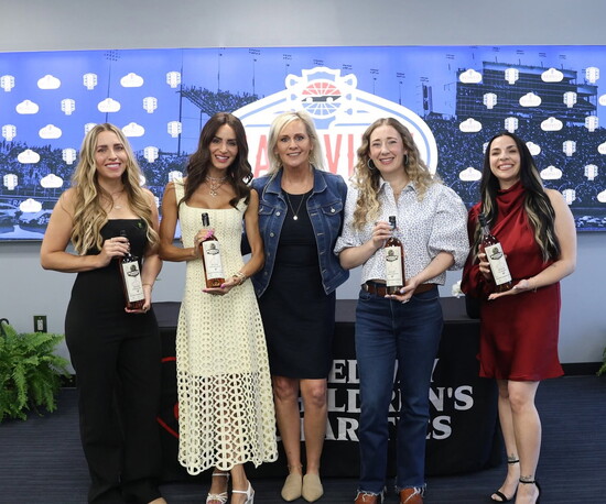 Traci, center, with guest speakers at Wheels & Heels