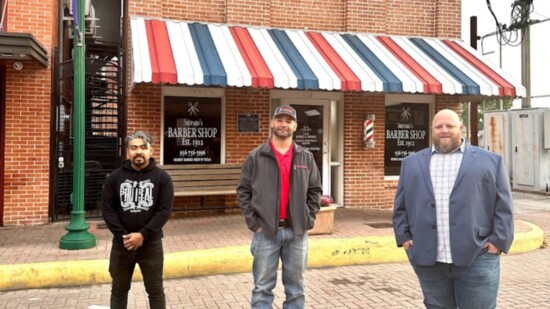 Cheng, Johnson, and Keller outside the oldest barber shop in Texas, - Shepard's. 