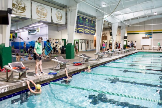 Swimmers get ready for a swim meet.