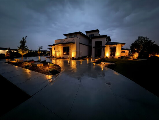 Outdoor lighting transforms homes after sunset, showcasing architectural details while improving safety and welcoming evening guests home.