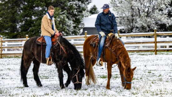 Ed Lamb guides his son Edward in equine therapy; Photography by Patrick Aspinall