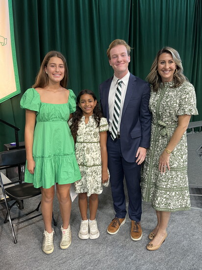Dr. Kinsey with student speakers at All school Convocation
