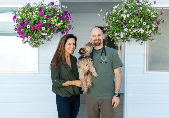 Katie Post (holding Tilly) and Dr. Brent Post of High Desert Veterinary. Photo credit: Natalie Stephenson