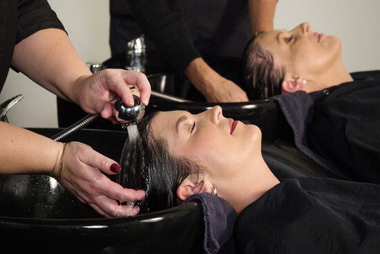Ashley Pedote with Jenna Pietrzak at the shampoo bowl