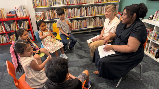 Elaine and Nikkia Ellis engaging students at the South End Library Branch in the Lathon Wider Community Center