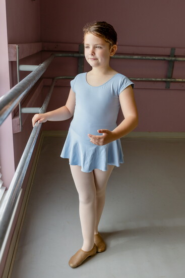 Young ballerina Gloria Dotson poses for a photo at Cullman Ballet Theatre School.