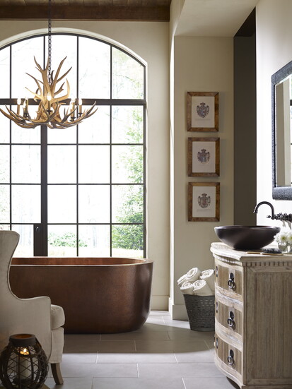 The Cuitzeo Tub, from Thompson Traders, is handcrafted with double-wall antique copper with a hammered antique copper finish. (Photography courtesy of Thompson)
