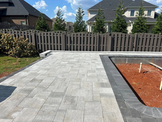 Gorgeous pavers around an inground swimming pool